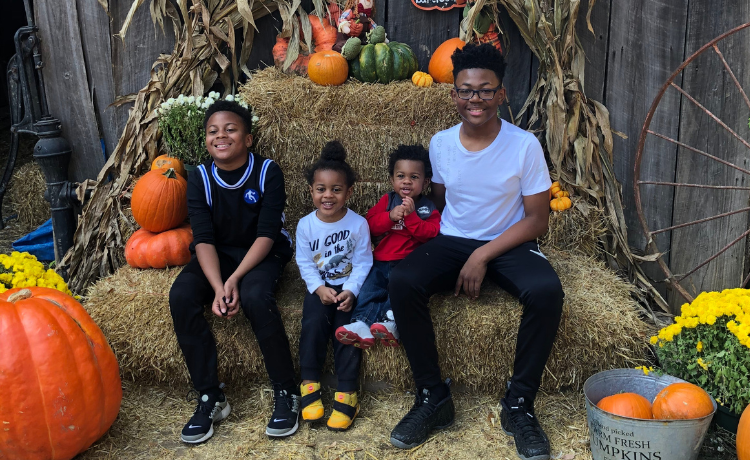 Katrina's 4 boys at a pumpkin farm