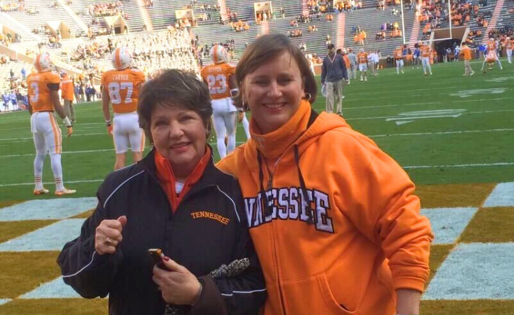 Nancy Knous and Carolyn Hughes on the field at a Vols Game